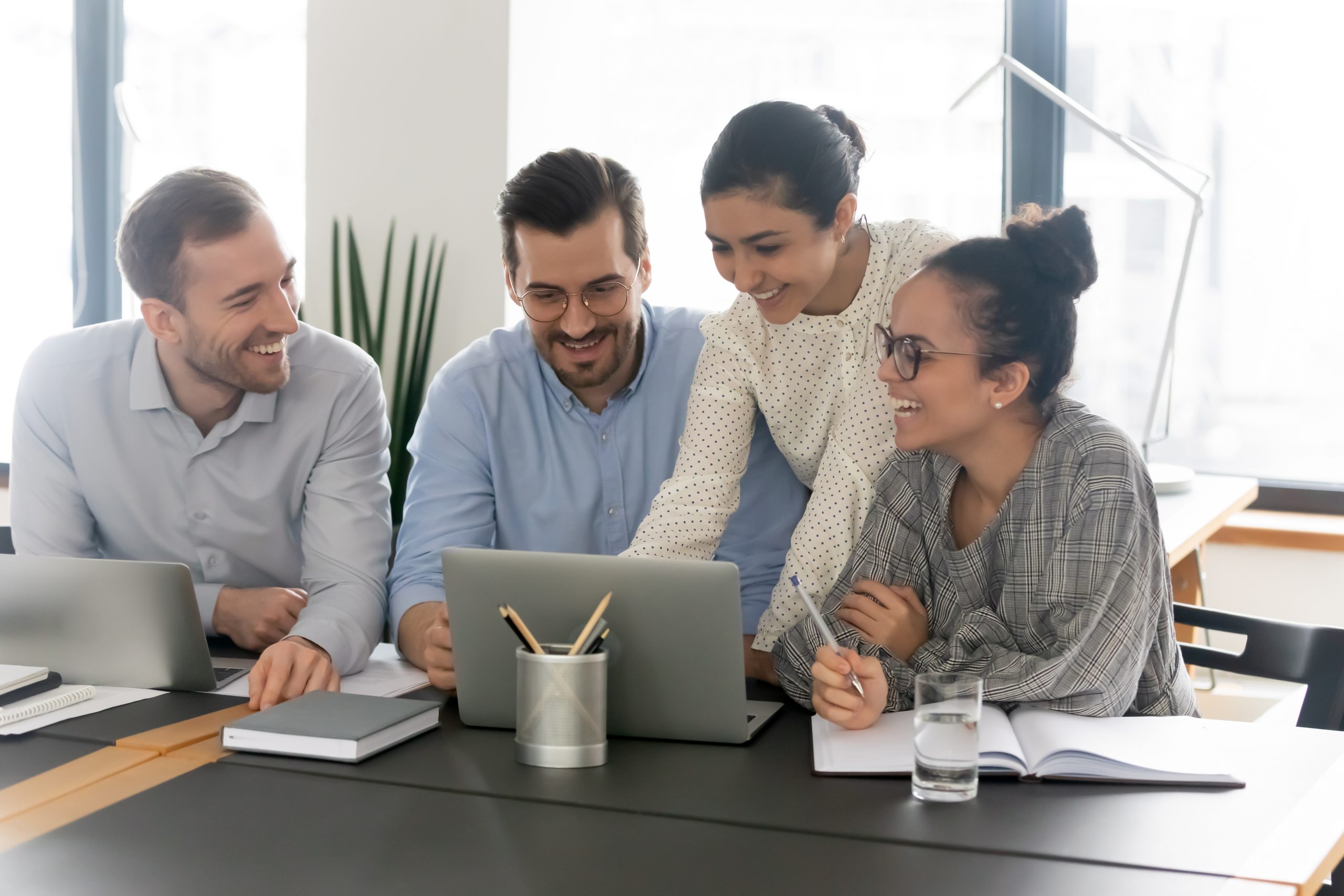 Happy,Young,Mixed,Race,Diverse,Female,And,Male,Colleagues,Discussing