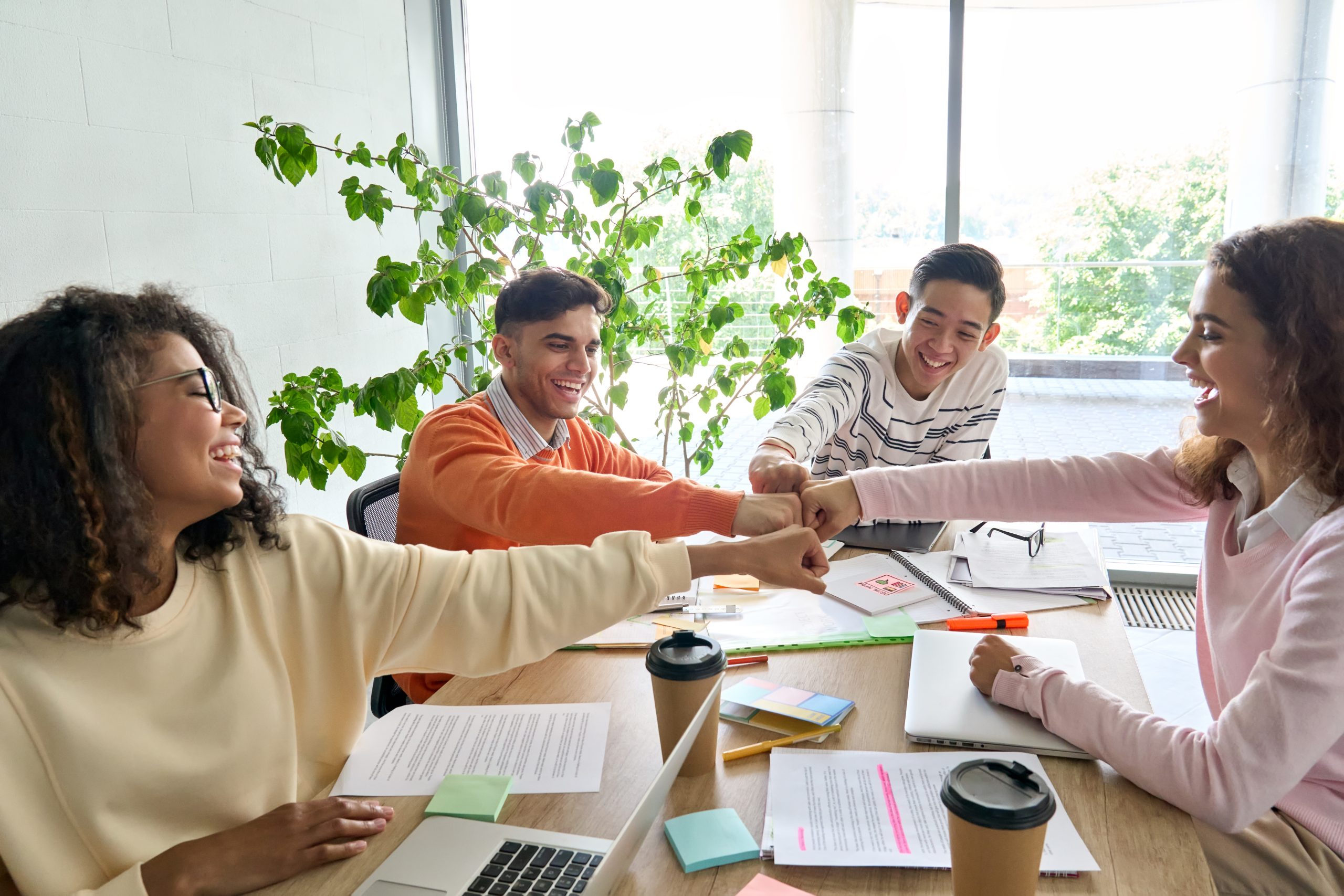 Young,Happy,Laughing,Creative,Startup,Team,Four,Multiethnic,Coworkers,Diverse